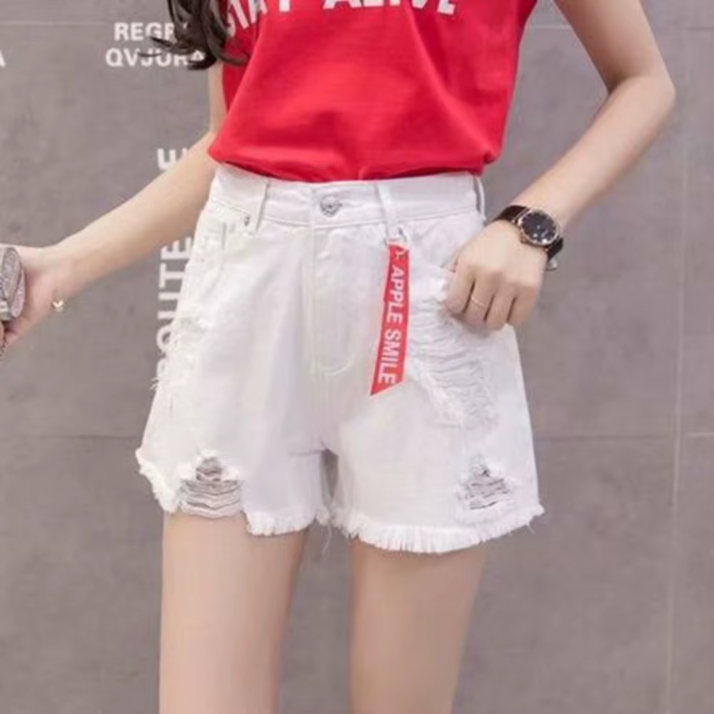 Shorts en jean tendance déchirés taille haute, polyvalents, avec ourlet effiloché et franges, 2024